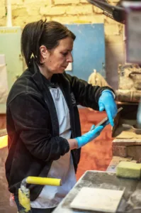 Theresa operates machinery making speiclaist ceramics.